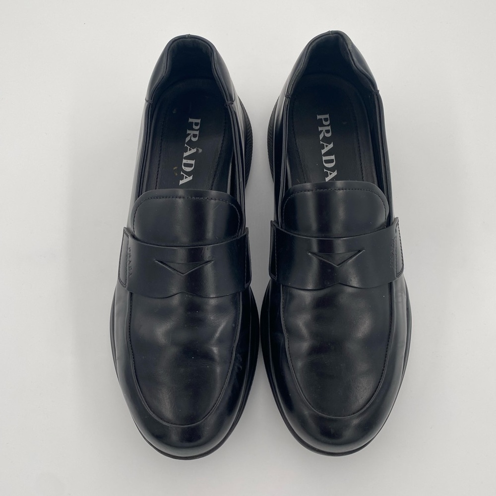 Prada Spazzolato Rois Leather Penny Loafers In Black